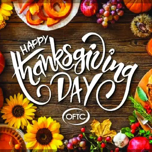 A festive Thanksgiving scene with sunflowers, pumpkins, grapes, nuts, and autumn leaves around the edges. The center features the text Happy Thanksgiving Day in stylish white lettering.