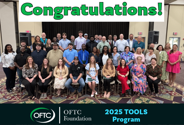 A large group of people pose indoors, smiling for a group photo beneath a bold Congratulations! banner, with OFTC Foundation 2025 TOOLS Program text at the bottom of the image.