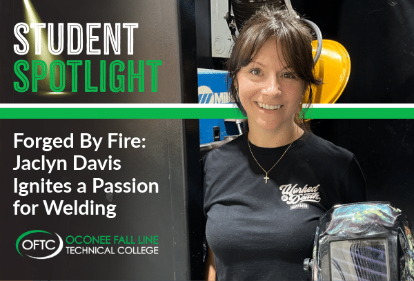 A smiling woman in a black Wicked Denim T-shirt stands next to welding equipment. Text reads: Student Spotlight: Forged By Fire, Jaclyn Davis Ignites a Passion for Welding. OFTC Oconee Fall Line Technical College.