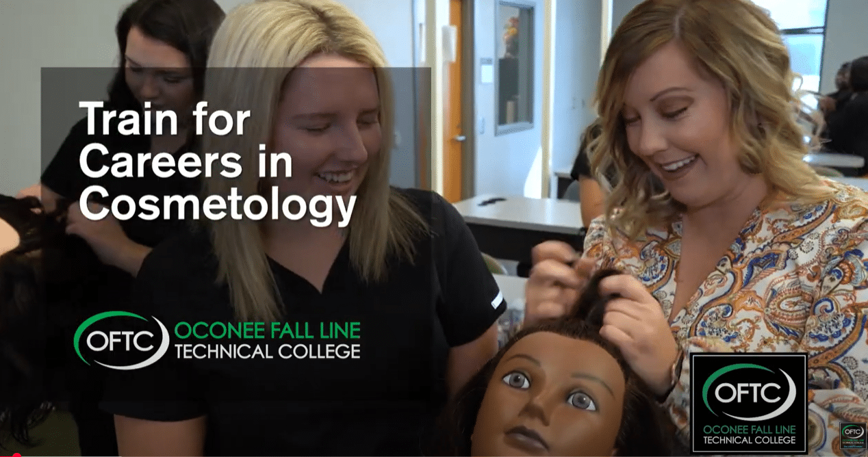 Two women smile while practicing hair styling on a mannequin head in a classroom. Text reads, Train for Careers in Cosmetology. OFTC Oconee Fall Line Technical College.