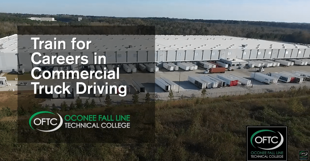 A large warehouse with many loading docks and trucks is shown. Text overlay reads, Train for Careers in Commercial Truck Driving. Oconee Fall Line Technical College OFTC. OFTC’s logo appears in the bottom corners.