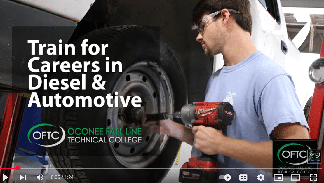 A man uses a power tool to work on a vehicle tire in a garage. Text reads: Train for Careers in Diesel & Automotive. OFTC Oconee Fall Line Technical College. OFTC logo appears in the lower right corner.
