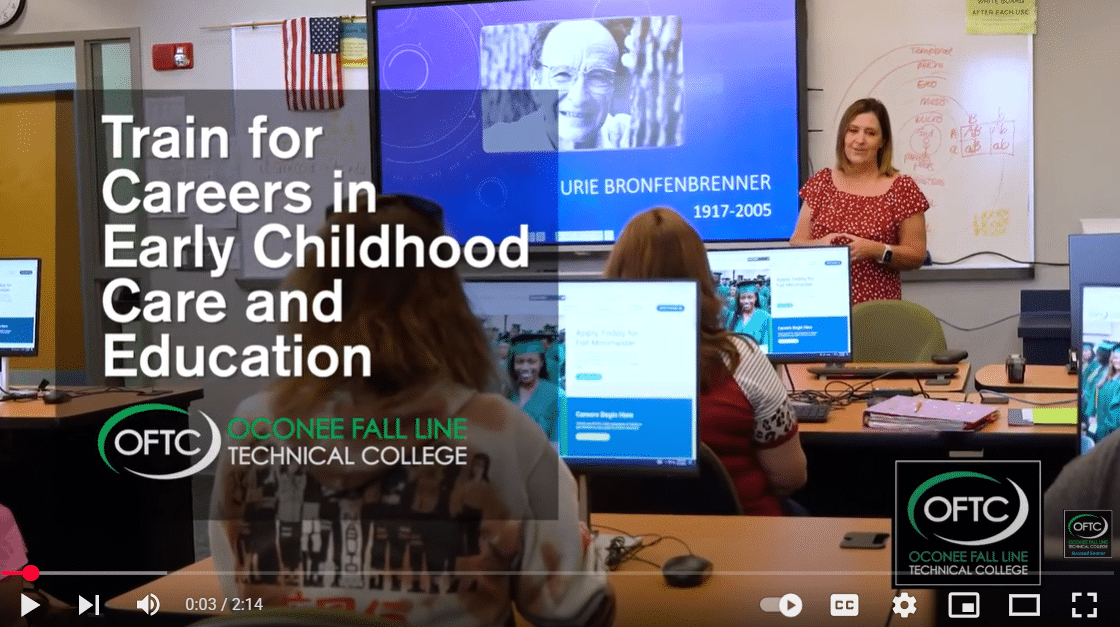 A classroom with students facing a teacher standing beside a screen displaying URIE BRONFENBRENNER 1917-2005. Text on the image says: Train for Careers in Early Childhood Care and Education. Oconee Fall Line Technical College.