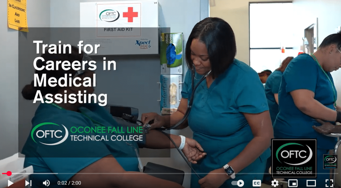 A woman in teal scrubs checks a patient's blood pressure in a medical office. Text reads, Train for Careers in Medical Assisting with the Oconee Fall Line Technical College logo. Another person in scrubs is in the background.