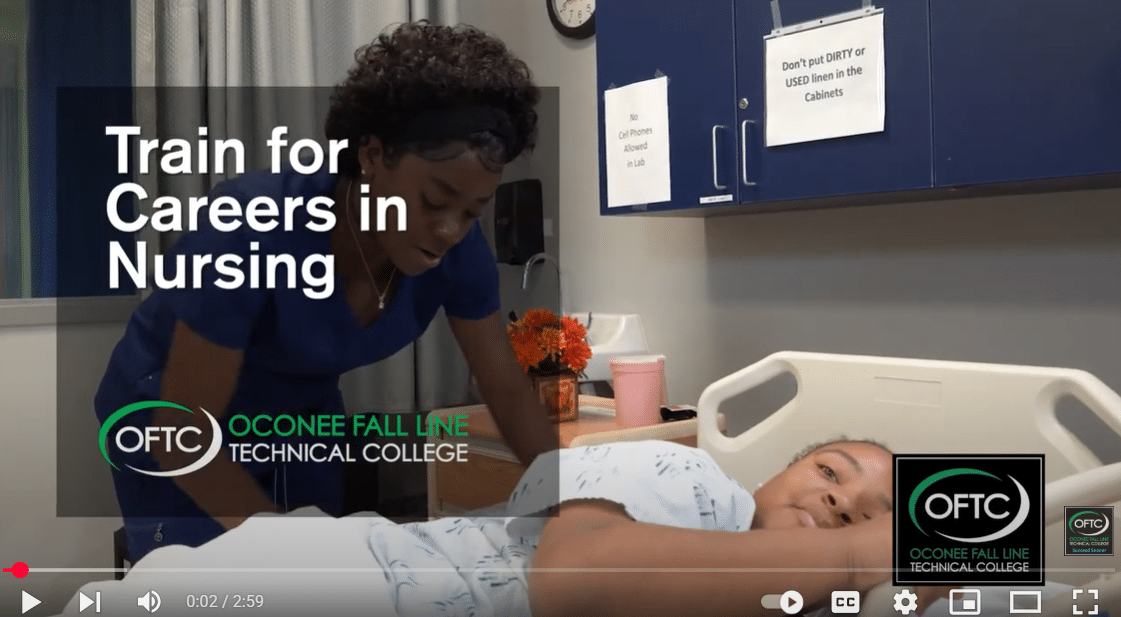 A nurse in blue scrubs assists a patient lying in a hospital bed. Text reads, Train for Careers in Nursing - Oconee Fall Line Technical College. Medical equipment and cabinets are visible in the background.