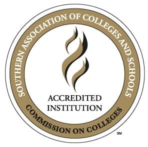 Circular logo for the Southern Association of Colleges and Schools Commission on Colleges, with Accredited Institution in the center and gold and black design elements.