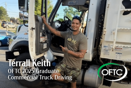 A smiling man in a t-shirt and shorts stands by an open truck door, pointing inside. Text: Terrall Keith, OFTC 2025 Graduate, Commercial Truck Driving, with the OFTC logo in the corner.