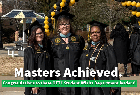 Three women in graduation caps and gowns stand outdoors, smiling, with yellow and black balloons behind them. Text reads: Masters Achieved. Congratulations to these OFTC Student Affairs Department leaders!.