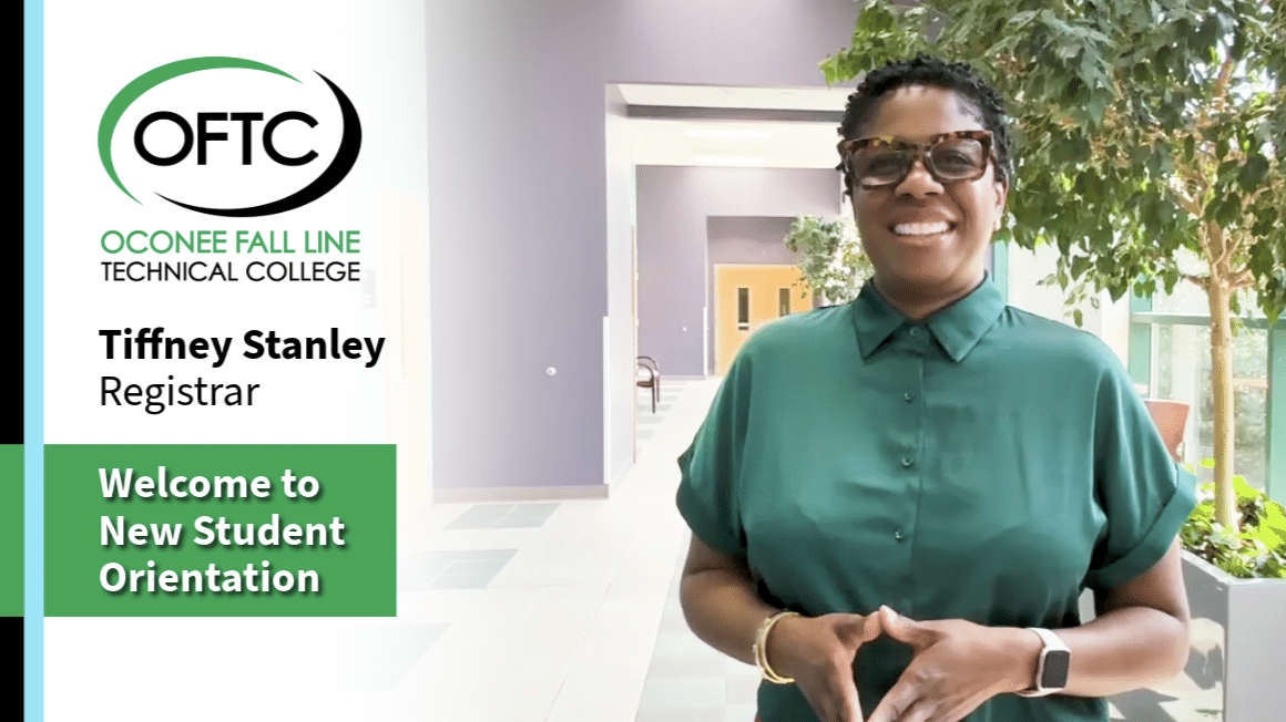 A smiling woman in a green shirt stands indoors near some plants. Text on the image welcomes students to Oconee Fall Line Technical College’s New Student Orientation and introduces Tiffney Stanley as the Registrar.