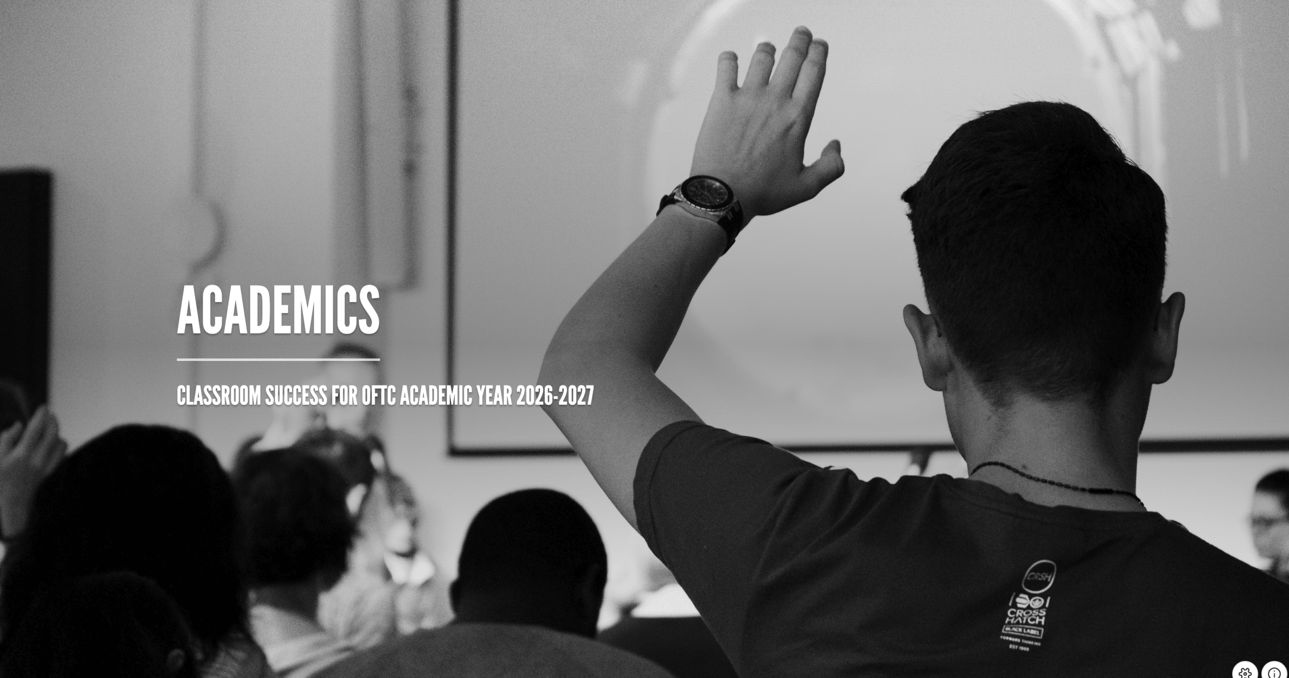 A student raises his hand in a classroom while facing a screen. The text reads, ACADEMICS. Classroom Success for OTC Academic Year 2026-2027.